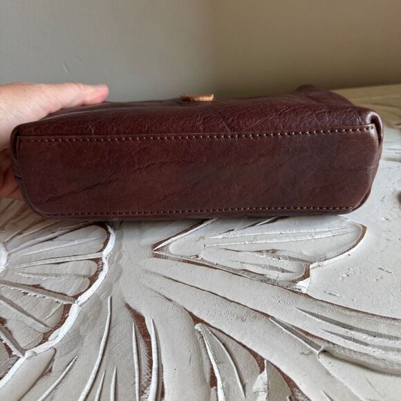 Brown leather handmade clutch with crossbody strap